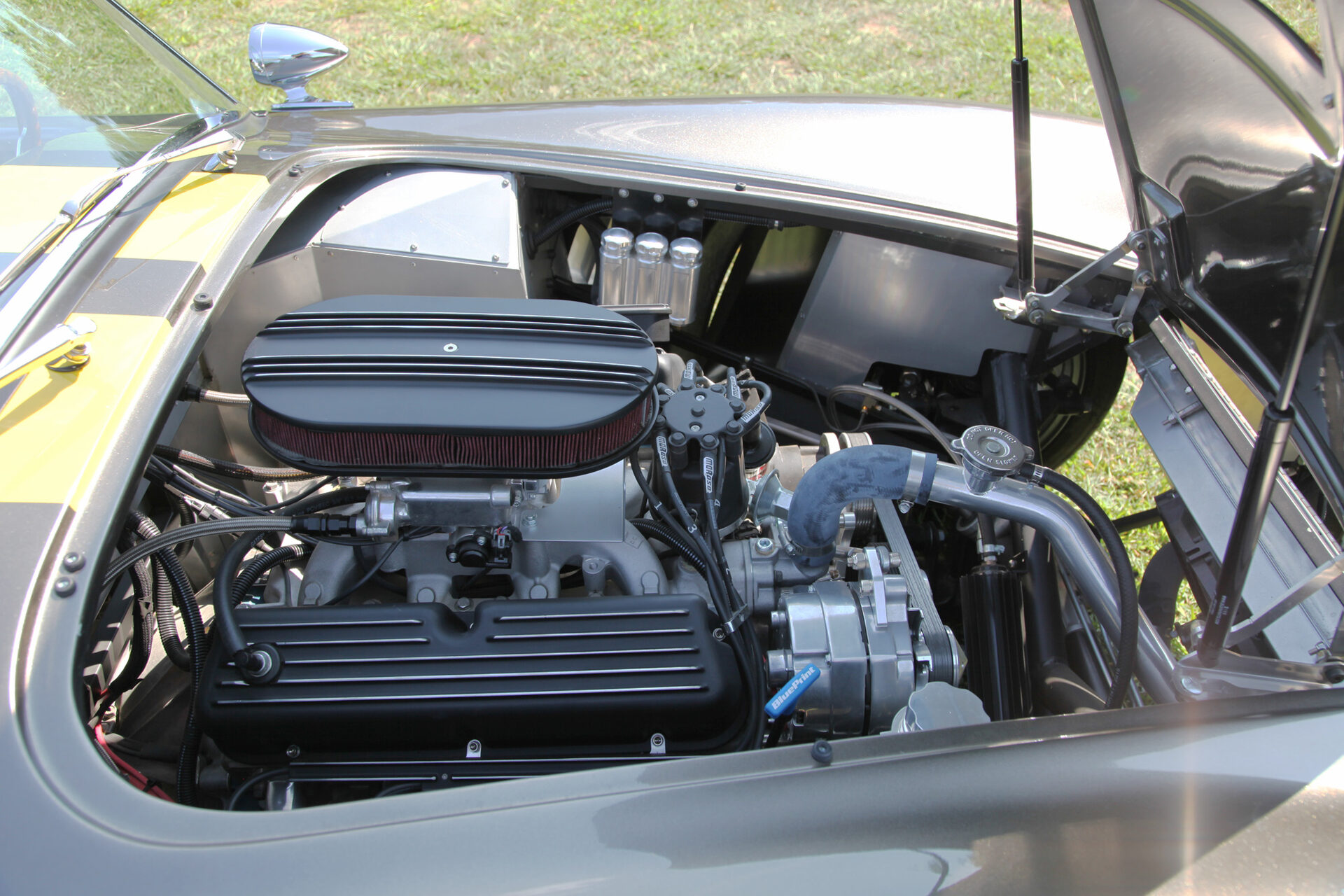 Engine bay of the Factory Five Cobra replica with hood open
